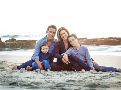 photo shows biker sherlock and his family on the beach.
